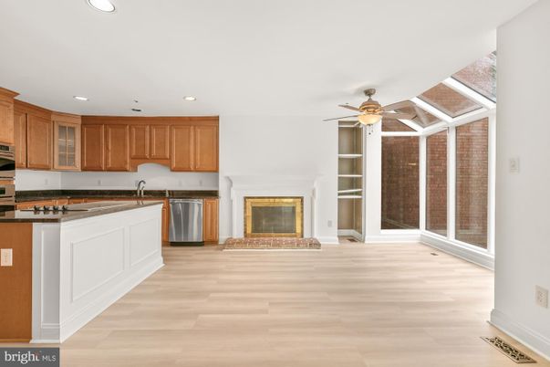 Fireplace, Interior, Kitchen, Recessed Lighting, Stainless Steel Appliances, Wood Texture Flooring