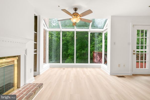 Fireplace, Interior, Sun Room, Wood Texture Flooring
