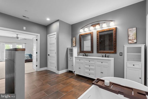 Bathroom, Dual Sink Vanities, Interior, Recessed Lighting, Wood Texture Flooring