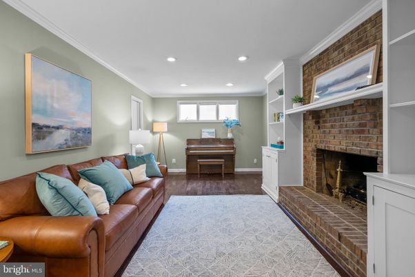 Fireplace, Interior, Living room, Piano, Recessed Lighting, Stone Walls, Wood Texture Flooring