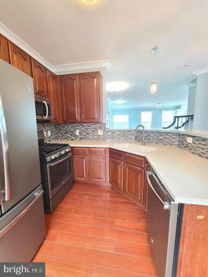 Dining room, Interior, Kitchen, Pendant Lights, Stainless Steel Appliances, Wood Texture Flooring