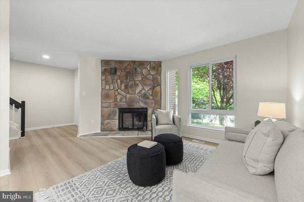 Fireplace, Interior, Living room, Recessed Lighting, Stone Walls, Wood Texture Flooring