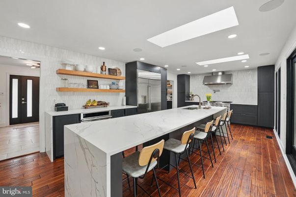 Interior, Kitchen, Marble Walls, Recessed Lighting, Stainless Steel Appliances, Wood Texture Flooring