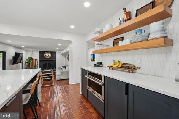 Fireplace, Interior, Kitchen, Recessed Lighting, Stainless Steel Appliances, Wood Texture Flooring