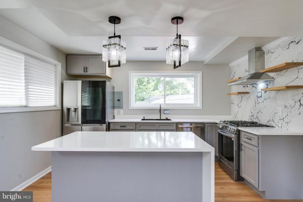 Interior, Kitchen, Marble Walls, Pendant Lights, Stainless Steel Appliances, Wood Texture Flooring
