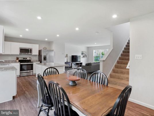 Dining room, Interior, Kitchen, Recessed Lighting, Stainless Steel Appliances, Wood Texture Flooring