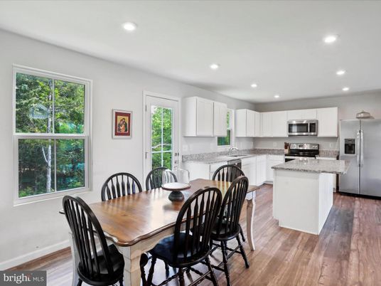 Dining room, Interior, Kitchen, Recessed Lighting, Stainless Steel Appliances, Wood Texture Flooring