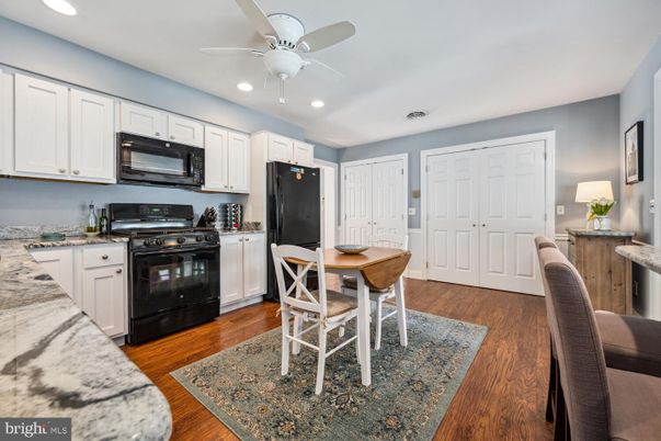 Dining room, Interior, Kitchen, Recessed Lighting, Stainless Steel Appliances, Wood Texture Flooring