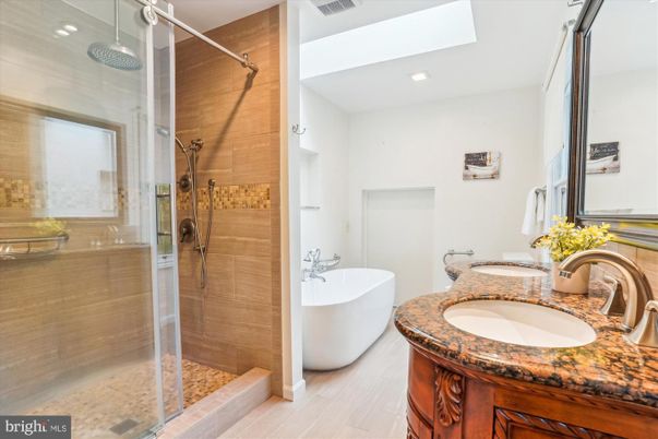 Bathroom, Dual Sink Vanities, Free Standing Baths, Glass Shower, Interior, Recessed Lighting, Wood Texture Flooring