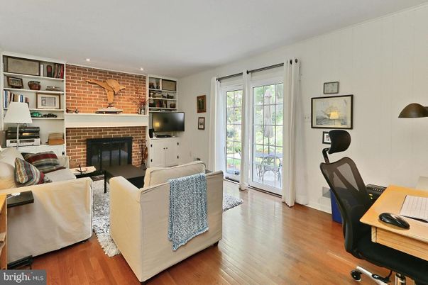 Fireplace, Interior, Living room, Recessed Lighting, Stone Walls, Wood Texture Flooring