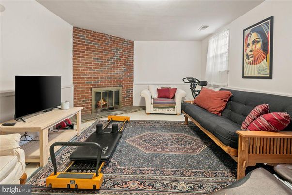 Fireplace, Fitness Equipment, Interior, Living room, Stone Walls, Wood Texture Flooring