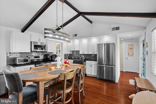 Dining room, Interior, Kitchen, Pendant Lights, Recessed Lighting, Stainless Steel Appliances, Wood Texture Flooring