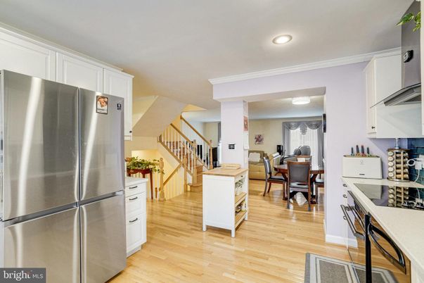 Dining room, Interior, Kitchen, Recessed Lighting, Stainless Steel Appliances, Wood Texture Flooring