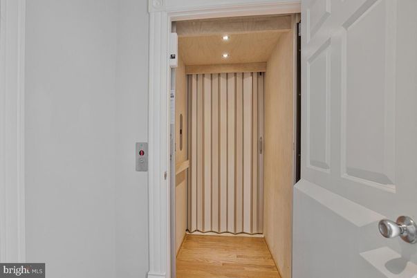 Elevator, Interior, Recessed Lighting, Wooden Ceilings, Wood Texture Flooring, Wooden Walls