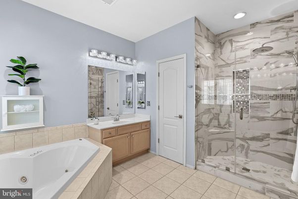 Bathroom, Dual Sink Vanities, Glass Shower, Interior, Marble Walls, Recessed Lighting