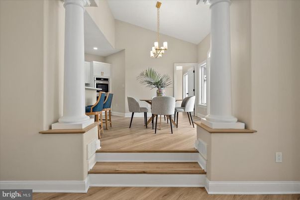 Chandelier, Dining room, Interior, Kitchen, Recessed Lighting, Stainless Steel Appliances, Wood Texture Flooring