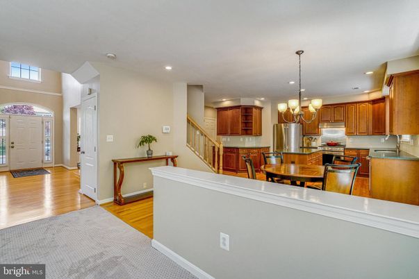 Chandelier, Dining room, Interior, Kitchen, Pendant Lights, Recessed Lighting, Stainless Steel Appliances, Wood Texture Flooring