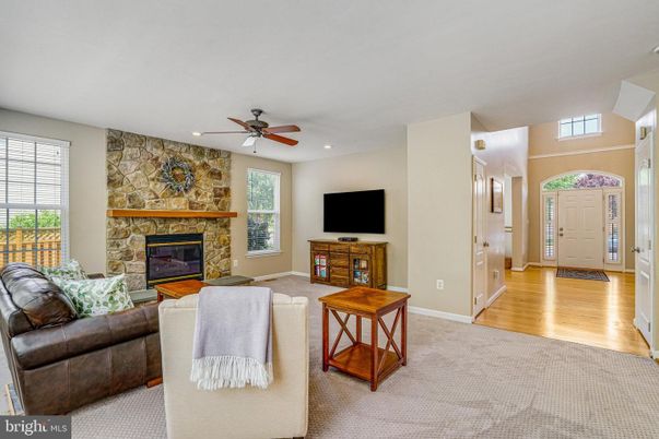 Fireplace, Interior, Living room, Recessed Lighting, Stone Walls, Wood Texture Flooring