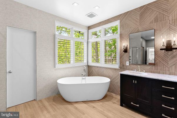 Bathroom, Dual Sink Vanities, Free Standing Baths, Interior, Recessed Lighting, Wood Texture Flooring