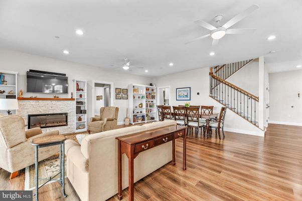 Dining room, Fireplace, Interior, Living room, Recessed Lighting, Wood Texture Flooring