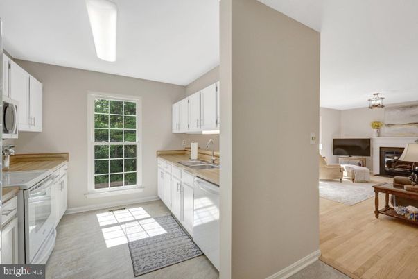 Fireplace, Interior, Kitchen, Living room, Pendant Lights, Tile Countertops, Wood Texture Flooring