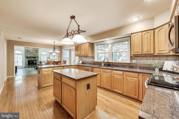Chandelier, Fireplace, Interior, Kitchen, Pendant Lights, Recessed Lighting, Wood Texture Flooring