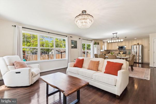 Chandelier, Dining room, Interior, Kitchen, Living room, Pendant Lights, Stainless Steel Appliances, Wood Texture Flooring