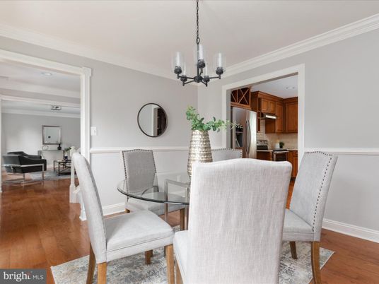 Chandelier, Dining room, Interior, Kitchen, Living room, Stainless Steel Appliances, Wood Texture Flooring