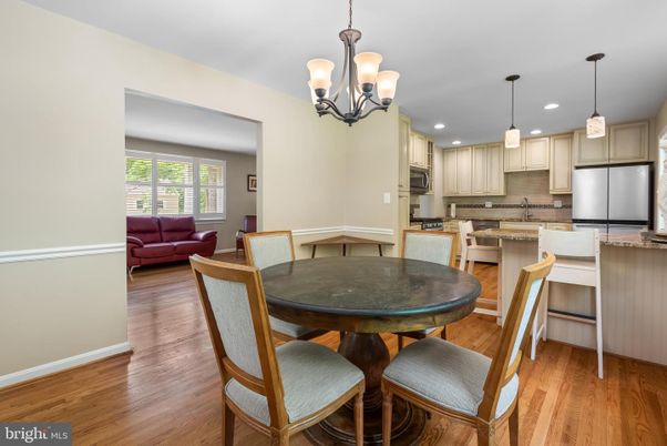 Chandelier, Dining room, Interior, Kitchen, Pendant Lights, Recessed Lighting, Stainless Steel Appliances, Wood Texture Flooring