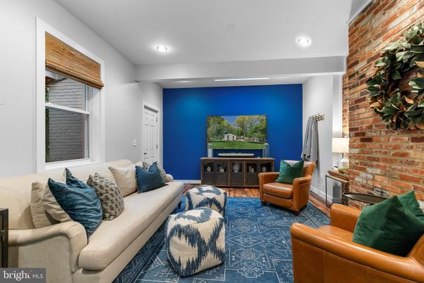 Fireplace, Interior, Living room, Recessed Lighting, Stone Walls, Wood Texture Flooring