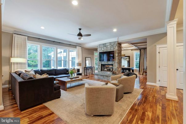 Fireplace, Interior, Living room, Recessed Lighting, Stone Walls, Wood Texture Flooring