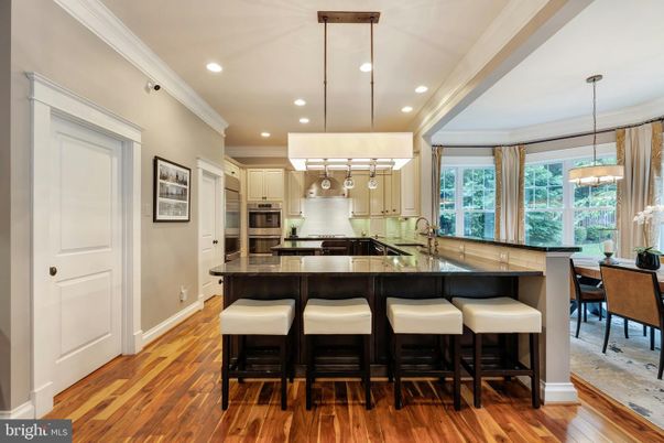 Chandelier, Dining room, Interior, Kitchen, Pendant Lights, Recessed Lighting, Stainless Steel Appliances, Wood Texture Flooring