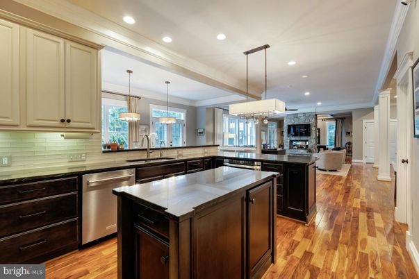 Fireplace, Interior, Kitchen, Living room, Pendant Lights, Recessed Lighting, Stainless Steel Appliances, Wood Texture Flooring