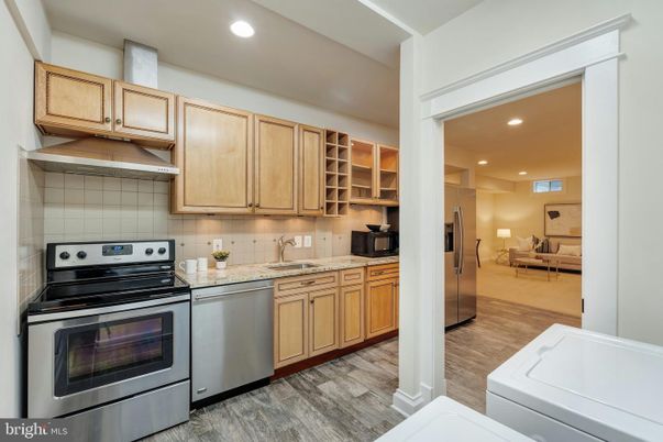 Dining room, Interior, Kitchen, Living room, Recessed Lighting, Stainless Steel Appliances, Wood Texture Flooring