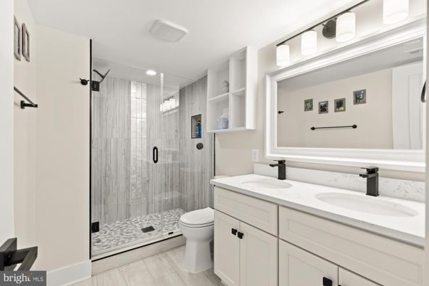 Bathroom, Dual Sink Vanities, Glass Shower, Interior, Recessed Lighting, Wood Texture Flooring