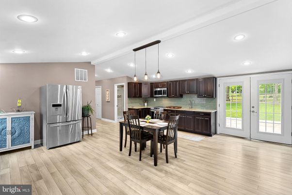 Dining room, Interior, Kitchen, Pendant Lights, Recessed Lighting, Stainless Steel Appliances, Wood Texture Flooring