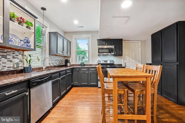 Dining room, Interior, Kitchen, Pendant Lights, Recessed Lighting, Stainless Steel Appliances, Wood Texture Flooring