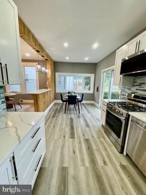 Dining room, Interior, Kitchen, Pendant Lights, Recessed Lighting, Stainless Steel Appliances, Wood Texture Flooring