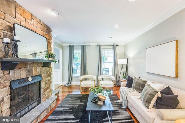 Fireplace, Interior, Living room, Recessed Lighting, Stone Walls, Wood Texture Flooring