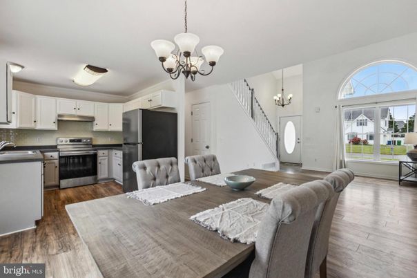 Chandelier, Dining room, Interior, Kitchen, Pendant Lights, Stainless Steel Appliances, Wood Texture Flooring
