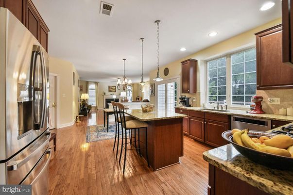 Chandelier, Dining room, Interior, Kitchen, Pendant Lights, Recessed Lighting, Stainless Steel Appliances, Wood Texture Flooring