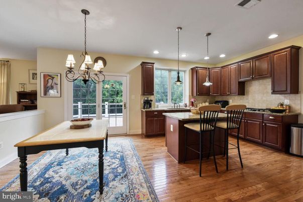 Chandelier, Dining room, Interior, Kitchen, Pendant Lights, Recessed Lighting, Stainless Steel Appliances, Wood Texture Flooring