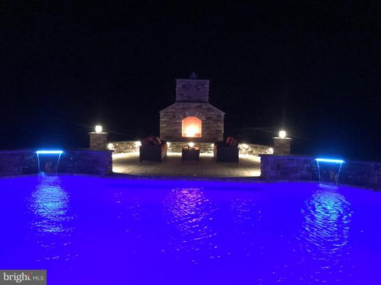 Exterior, Fireplace, Pool