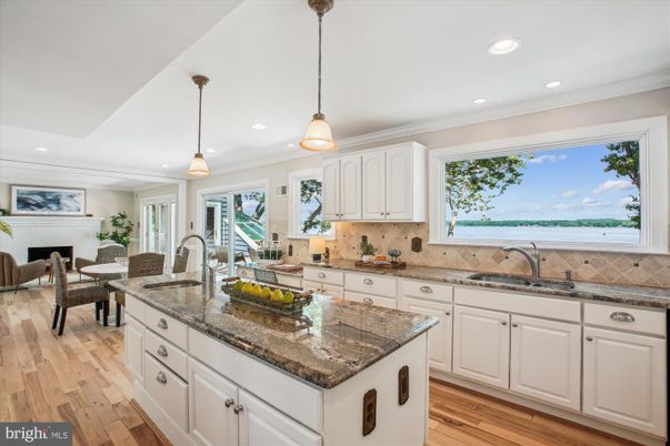 Fireplace, Interior, Kitchen, Living room, Pendant Lights, Recessed Lighting, Water, Wood Texture Flooring