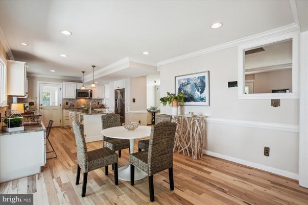 Dining room, Interior, Kitchen, Pendant Lights, Recessed Lighting, Stainless Steel Appliances, Wood Texture Flooring