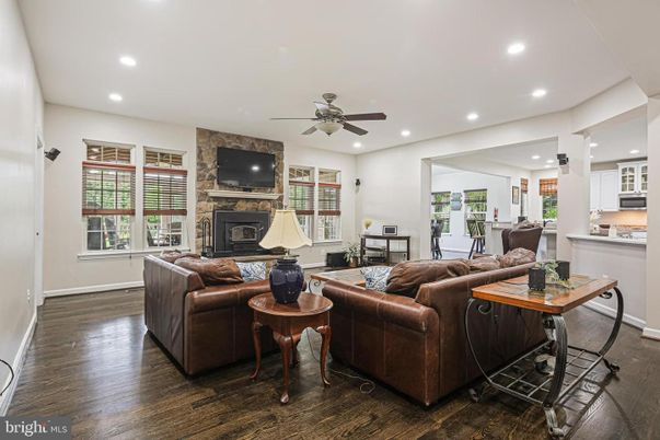 Fireplace, Interior, Living room, Recessed Lighting, Stone Walls, Wood Texture Flooring