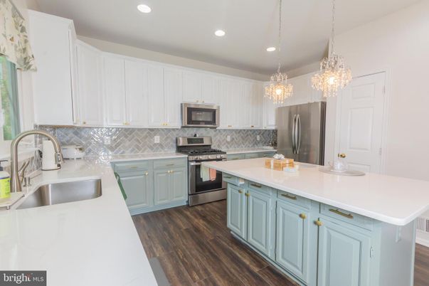 Chandelier, Interior, Kitchen, Pendant Lights, Recessed Lighting, Stainless Steel Appliances, Wood Texture Flooring