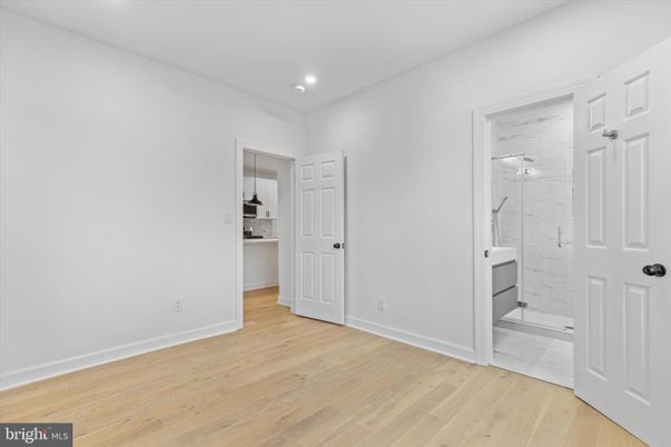 Bathroom, Glass Shower, Interior, Marble, Marble Walls, Recessed Lighting, Wood Texture Flooring
