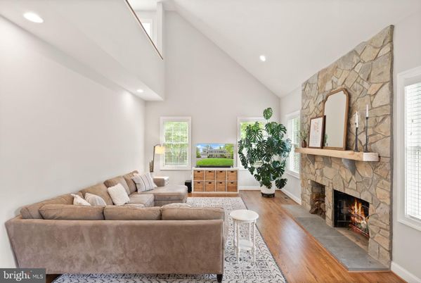 Fireplace, Interior, Living room, Recessed Lighting, Stone Walls, Wood Texture Flooring
