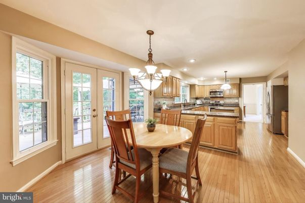 Chandelier, Dining room, Interior, Kitchen, Recessed Lighting, Stainless Steel Appliances, Wood Texture Flooring